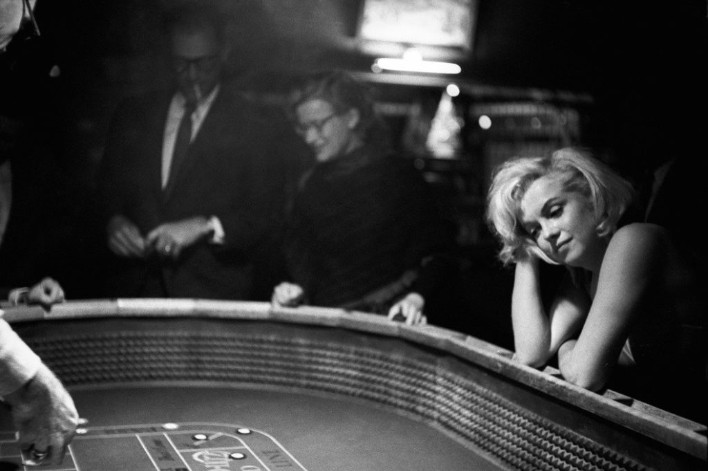 UNITED STATES. Nevada. While in Nevada, John Huston spent long hours, sometimes nights, at the Reno gambling tables. Marilyn MONROE accompanied him once, towards the end of the shooting. The Misfits. 1960. EVE ARNOLD