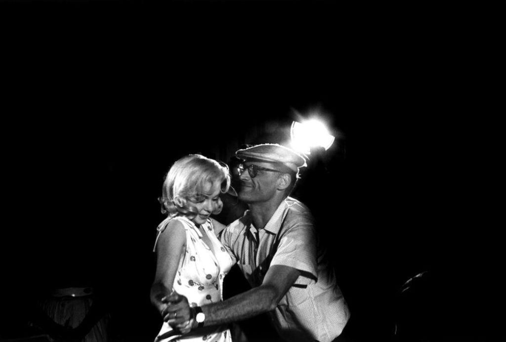 UNITED STATES. Nevada. Reno. American actress MARILYN MONROE with Arthur MILLER showing her some dance steps for a scene she is to perform. Miller described how his father used to "Skip-to-my-lou", a rustic dance from Central America. 1960.